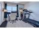 Home office with treadmill and desk setup at 14221 E 1St Dr # 304, Aurora, CO 80011