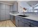 Updated kitchen with stainless steel appliances and gray cabinets at 14221 E 1St Dr # 304, Aurora, CO 80011