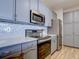 Updated kitchen featuring stainless steel appliances and gray cabinets at 14221 E 1St Dr # 304, Aurora, CO 80011