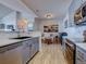 Modern kitchen with stainless steel appliances and gray cabinets at 14221 E 1St Dr # 304, Aurora, CO 80011