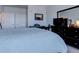 Main bedroom with large bed and dresser at 14221 E 1St Dr # 304, Aurora, CO 80011