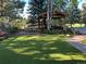 Enjoy the spacious backyard with a gazebo, lush lawn, and inviting patio for outdoor living at 7088 Indian Peaks Trl, Boulder, CO 80301