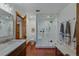 Bathroom featuring a large shower, toilet, and vanity with marble countertop at 7088 Indian Peaks Trl, Boulder, CO 80301