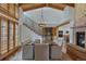 Elegant dining room featuring a wooden table, modern chairs, and an iron staircase at 7088 Indian Peaks Trl, Boulder, CO 80301
