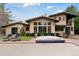 Rear exterior featuring hot tub, lawn area, and exterior home architecture at 7088 Indian Peaks Trl, Boulder, CO 80301