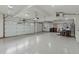 Spacious three-car garage with ample storage and pristine flooring at 7088 Indian Peaks Trl, Boulder, CO 80301