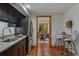 Convenient kitchenette boasts stainless steel fridge, modern countertops, and a cozy dining space at 7088 Indian Peaks Trl, Boulder, CO 80301