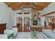 Open-concept living room with a stone fireplace, wood floors, and modern decor at 7088 Indian Peaks Trl, Boulder, CO 80301