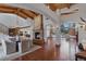 Spacious living room with wood floors, a stone fireplace, and vaulted ceilings at 7088 Indian Peaks Trl, Boulder, CO 80301