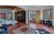 Bedroom with terracotta tile, a four poster bed, wood accents, and a stylish ottoman at 7088 Indian Peaks Trl, Boulder, CO 80301