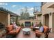 Inviting outdoor patio featuring a fireplace, comfortable seating, and stylish decor at 7088 Indian Peaks Trl, Boulder, CO 80301