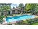 Aerial view of a large in-ground pool with a hot tub and outdoor lounge area at 7088 Indian Peaks Trl, Boulder, CO 80301