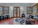 Sitting area with a fireplace, natural light and terracotta tile at 7088 Indian Peaks Trl, Boulder, CO 80301