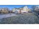Large backyard with grass area, patio with furniture, shed, and privacy fence at 3801 S Joplin St, Aurora, CO 80013
