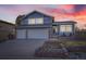 Charming two-story home with blue siding, brick accents, and well-maintained front yard landscaping at 3801 S Joplin St, Aurora, CO 80013