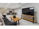 Finished basement area with modern decor, offering both relaxation and workspace areas, and a mounted television at 6902 S Jackson Way, Centennial, CO 80122