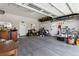 Spacious garage with ample storage, shelving, and room for vehicles, bikes, and equipment at 6902 S Jackson Way, Centennial, CO 80122