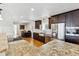 Beautiful kitchen with stainless appliances, granite counters and wooden cabinets, adjacent to the dining area at 6902 S Jackson Way, Centennial, CO 80122