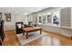 Cozy living room with hardwood floors, plantation shutters, and ample natural light at 6902 S Jackson Way, Centennial, CO 80122