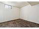 Basement featuring carpet flooring, neutral walls, and a window at 14830 Robins Dr, Denver, CO 80239