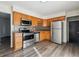 Well-equipped kitchen with stainless steel appliances and ample cabinet space at 14830 Robins Dr, Denver, CO 80239