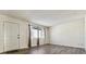 Bright living room features new floors, and a large window allowing for ample natural light at 14830 Robins Dr, Denver, CO 80239