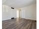 Open living room showcases plenty of space, new floors, and bright, white walls at 14830 Robins Dr, Denver, CO 80239