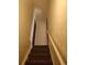Interior staircase leading to upper level at 14830 Robins Dr, Denver, CO 80239