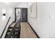 Clean and bright upstairs hallway with hardwood floors and modern railing at 1565 N Winona Ct, Denver, CO 80204