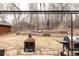 Backyard patio features a grill and outdoor fireplace providing the perfect spot for outdoor living and entertaining at 14080 Crabapple Rd, Golden, CO 80401