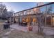 Backyard featuring outdoor dining area and a unique, glass-enclosed sunroom at 14080 Crabapple Rd, Golden, CO 80401