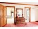 Bedroom view with antique dresser and multiple doors leading to other rooms offering ample space and storage at 14080 Crabapple Rd, Golden, CO 80401