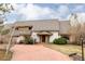 Attractive two-story home with brick driveway and manicured lawn at 14080 Crabapple Rd, Golden, CO 80401