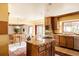 Charming kitchen with island, warm wood cabinets, and stainless appliances at 14080 Crabapple Rd, Golden, CO 80401