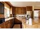 Spacious kitchen with granite countertops, wood cabinets, stainless steel appliances and breakfast bar at 14080 Crabapple Rd, Golden, CO 80401