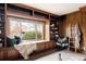 Beautiful library with custom shelving, window seat, and lots of natural light at 14080 Crabapple Rd, Golden, CO 80401