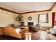 Bright and airy living room with a fireplace, hardwood floors, and neutral décor at 14080 Crabapple Rd, Golden, CO 80401