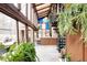 Light-filled sunroom with a spiral staircase, skylights, and an abundance of plants at 14080 Crabapple Rd, Golden, CO 80401