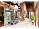 Sunroom with spiral stairs, stone floors, wood beams and plenty of room for plants at 14080 Crabapple Rd, Golden, CO 80401