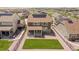 Aerial view showcasing a home with solar panels, a well-kept lawn, and neighborhood amenities at 8240 S White Crow St, Aurora, CO 80016