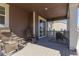 Covered back deck with outdoor seating at 8240 S White Crow St, Aurora, CO 80016