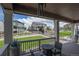 Cozy back porch featuring outdoor furniture and providing a serene view of the backyard and surrounding area at 8240 S White Crow St, Aurora, CO 80016