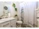 Bathroom featuring modern fixtures, vanity, and a shower with decorative curtain at 8240 S White Crow St, Aurora, CO 80016