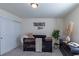 Charming Bedroom featuring a crib with black finish, modern decor, and neutral tones at 8240 S White Crow St, Aurora, CO 80016