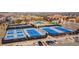 Aerial view highlighting community tennis courts and pool area, showcasing luxurious recreation at 8240 S White Crow St, Aurora, CO 80016