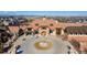 A beautiful front exterior aerial view, showcasing a luxurious home with a circular driveway and well-manicured landscaping at 8240 S White Crow St, Aurora, CO 80016