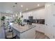 Modern eat-in kitchen featuring pendant lighting, stainless steel appliances, and granite countertops at 8240 S White Crow St, Aurora, CO 80016