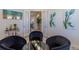 Sitting Room featuring glass paneled doors and modern art at 8240 S White Crow St, Aurora, CO 80016