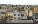 Backyard aerial view shows fence, patio, and surrounding neighborhood at 1065 Cobblestone Dr, Highlands Ranch, CO 80126