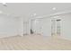Open basement with wood laminate flooring, can lights, and access to stairs at 1065 Cobblestone Dr, Highlands Ranch, CO 80126